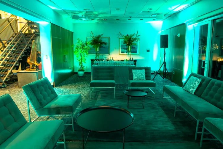 VIP Room with lounge furniture, green uplighting, and decor, for a VIP lounge area