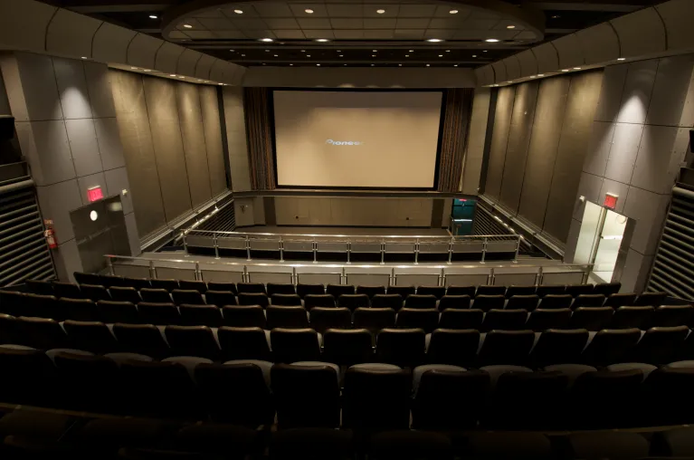 Theater seating facing large theater screen